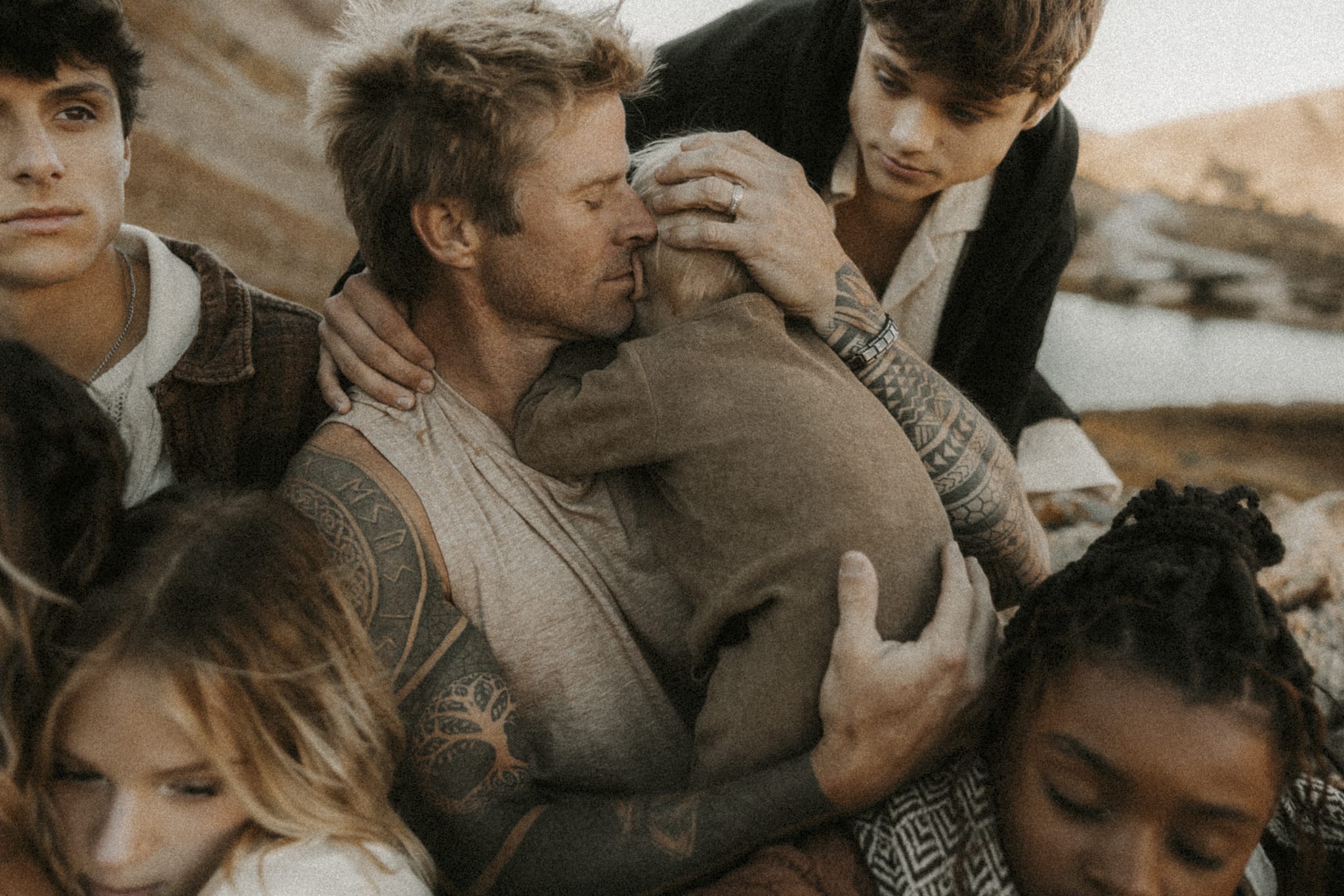 Family Photography, Family cuddled up to dad, dad holding baby
